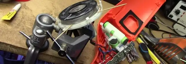 Vacuum cleaner repair parts and tools on a workbench in Shreveport, LA