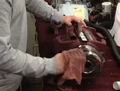 Vacuum repair technician cleaning and servicing a vacuum motor in Shreveport, LA